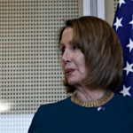 nancy pelosi in front of american flag